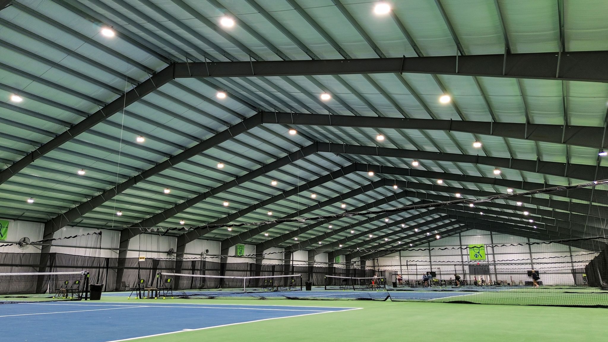 Mando metal concrete building pad and steel building erection project feature: 316 Tennis